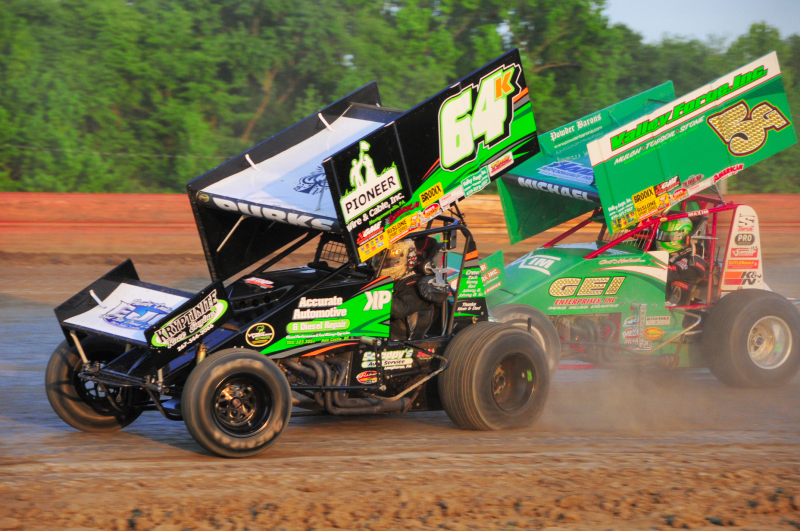 Kyle Purks (64K) and eventual feature winner Curt Michael (5G) in a qualifying heat.