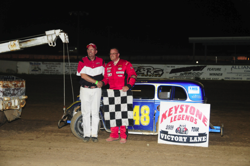 Chief Starter Gary Buzby congratulates Jason Rochelle for winning the Legends feature.