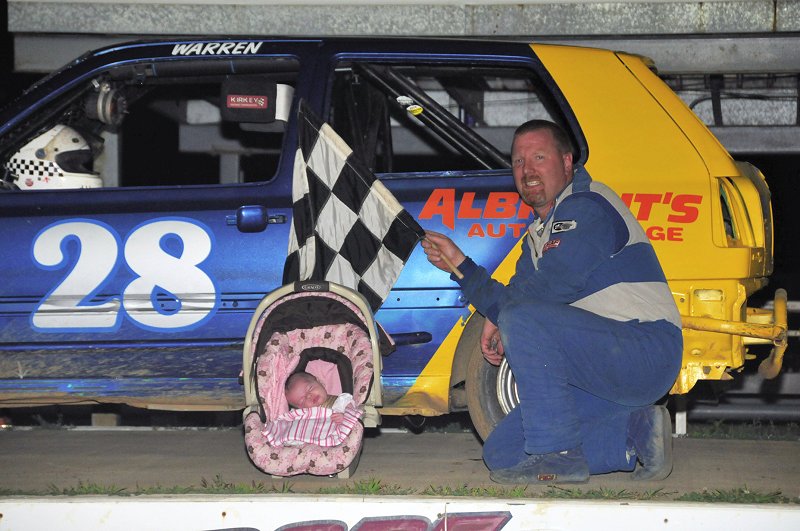 Warren Stradely won the 4-cylinder race and celebrated with his newborn in Victory Lane.