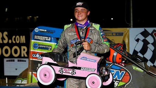 <strong>Zeb Wise proudly holds the pedal car trophy after capturing Friday night's Pennsylvania Midget Week feature at Linda's Speedway.<br />
(Michael Fry Photo)<br />
</strong>